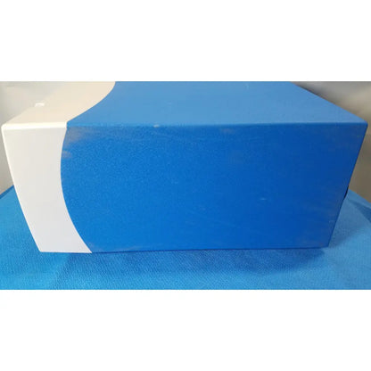 Blue and white rectangular covidien se3690 smoke evacuator box with curved design for surgical smoke removal