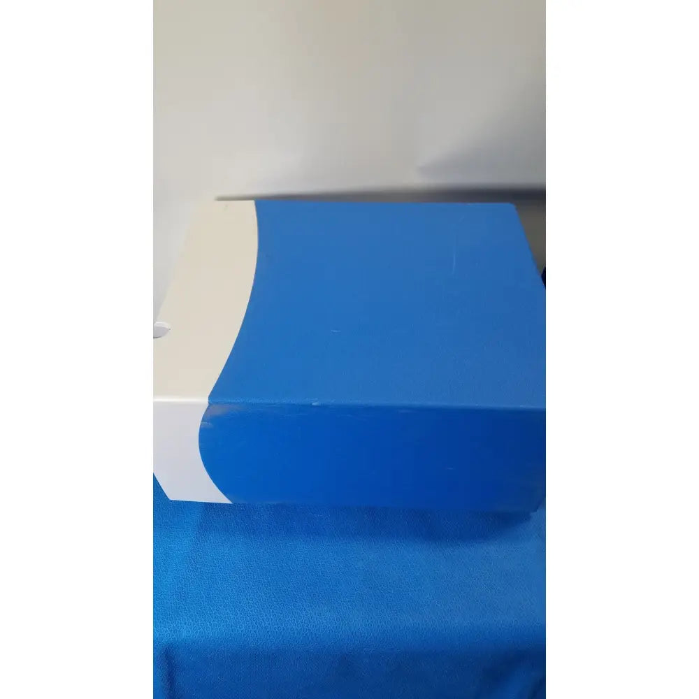 Blue and white rectangular covidien se3690 smoke evacuator with curved design for surgical smoke removal
