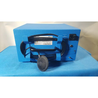Blue rectangular covidien se3690 smoke evacuator with black coiled cable and gray circular fan attachment for smoke removal