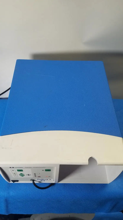 Blue and white covidien se3690 smoke evacuator medical device with control panel on the side for surgical smoke removal