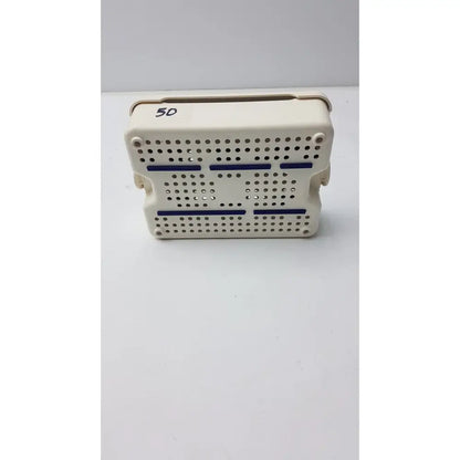 Beige plastic covidien sonicision sterilization container tray with blue stripes and perforated surface for surgical use