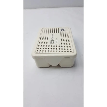 Off-white plastic covidien sonicision sterilization container tray with perforated lid and covidien sonocision branding