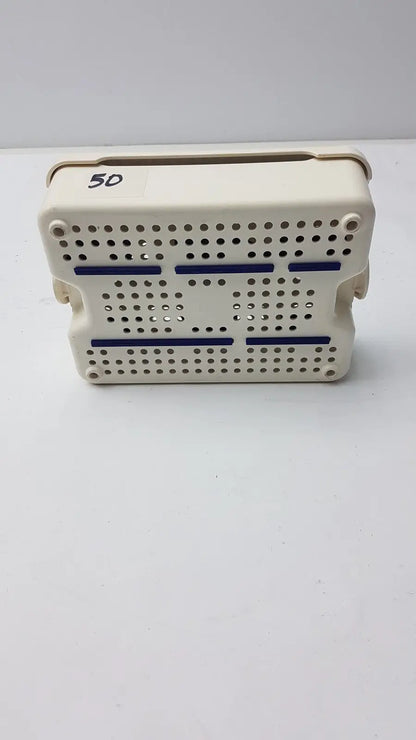 Beige plastic covidien sonicision sterilization container tray with blue stripes and perforated surface for surgical use