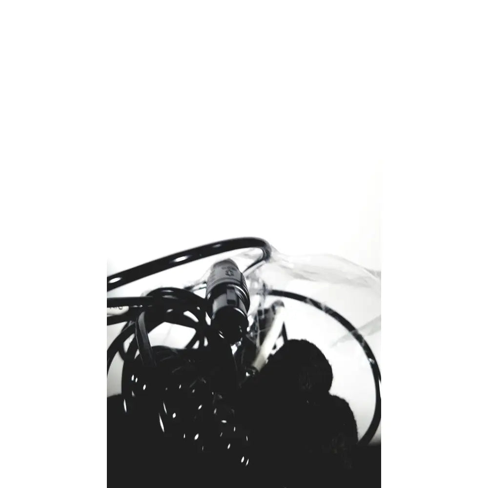 A black coiled cable with a metallic connector for the covidien super dimension i logic in reach navigation system
