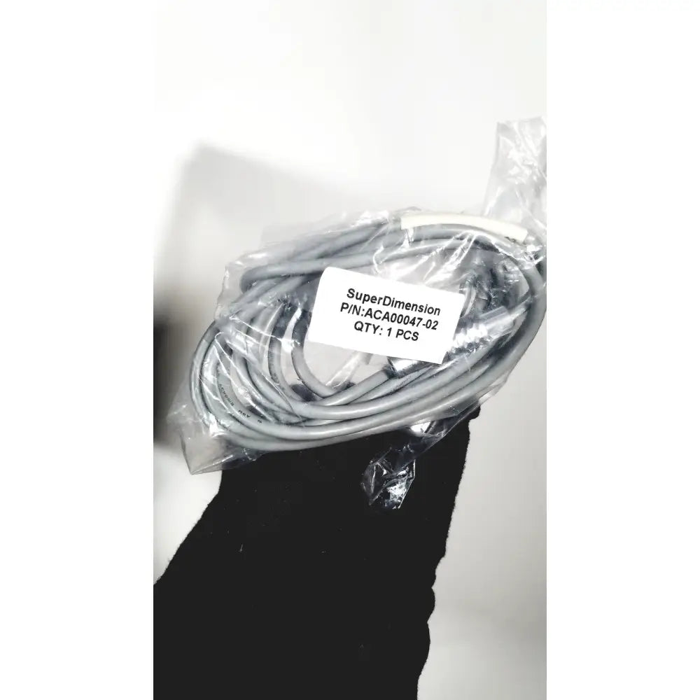 Gray coiled cable in clear packaging with covidien super dimension label for logic in reach navigation system