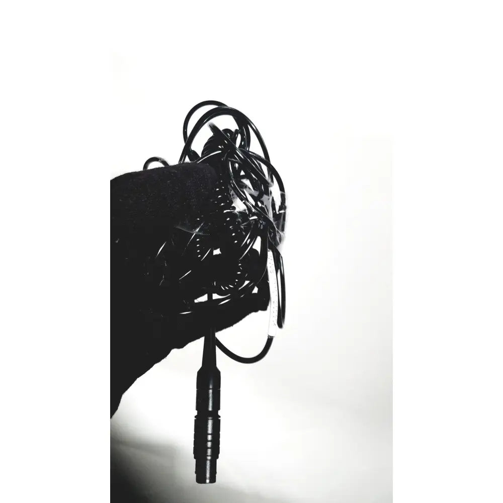 A tangled black cable with a textured ribbed connector for the covidien super dimension i logic in reach navigation system