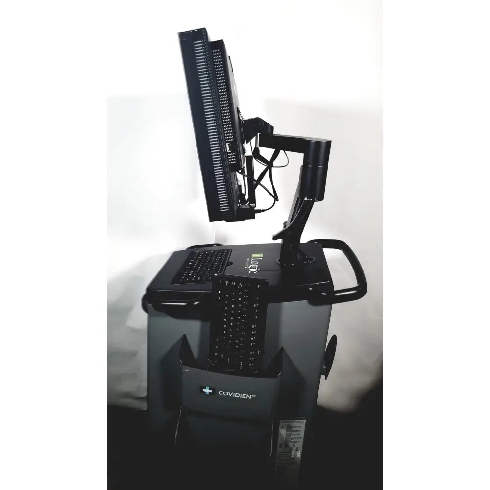 Black covidien super dimension dual-monitor medical workstation with adjustable arms and integrated keyboard tray