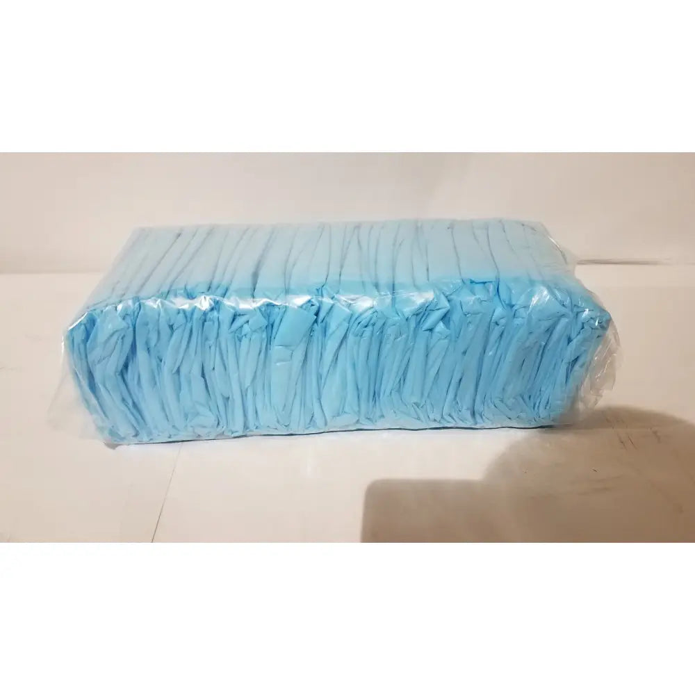 A rectangular package of light blue disposable diapers wrapped in clear plastic unrelated to cpe isolation gown product