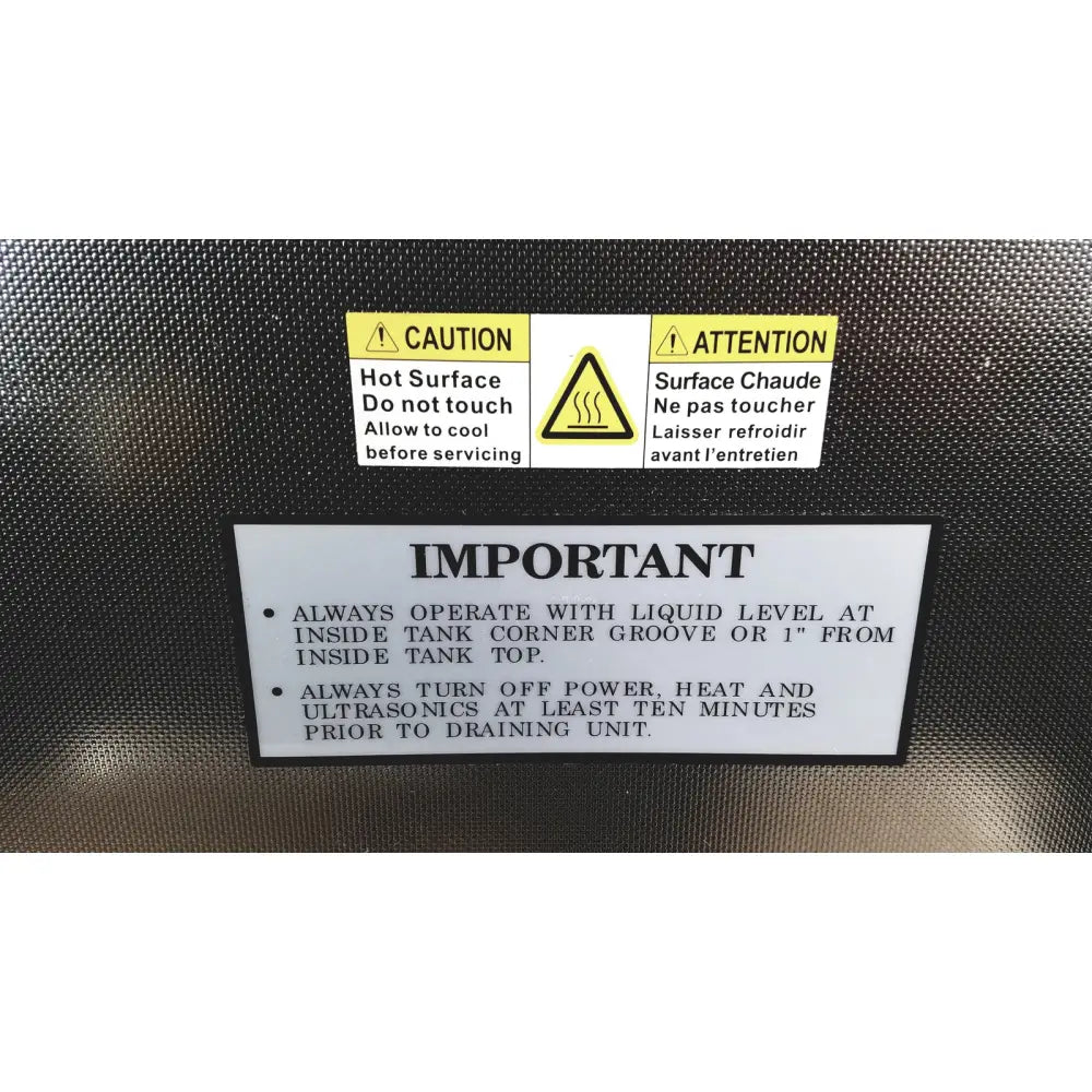 Black textured back surface of crest ultrasonic powersonic cleaner model p1100d with caution and warning labels in english and french