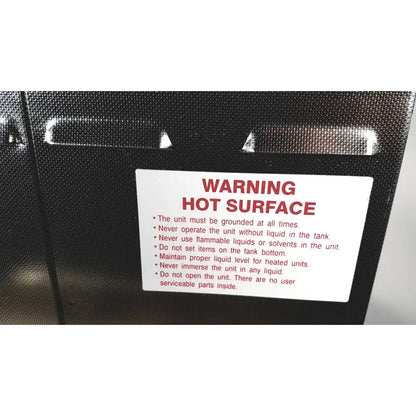 Black textured surface with white warning label and red text warning hot surface on crest ultrasonic powersonic cleaner model p1100d