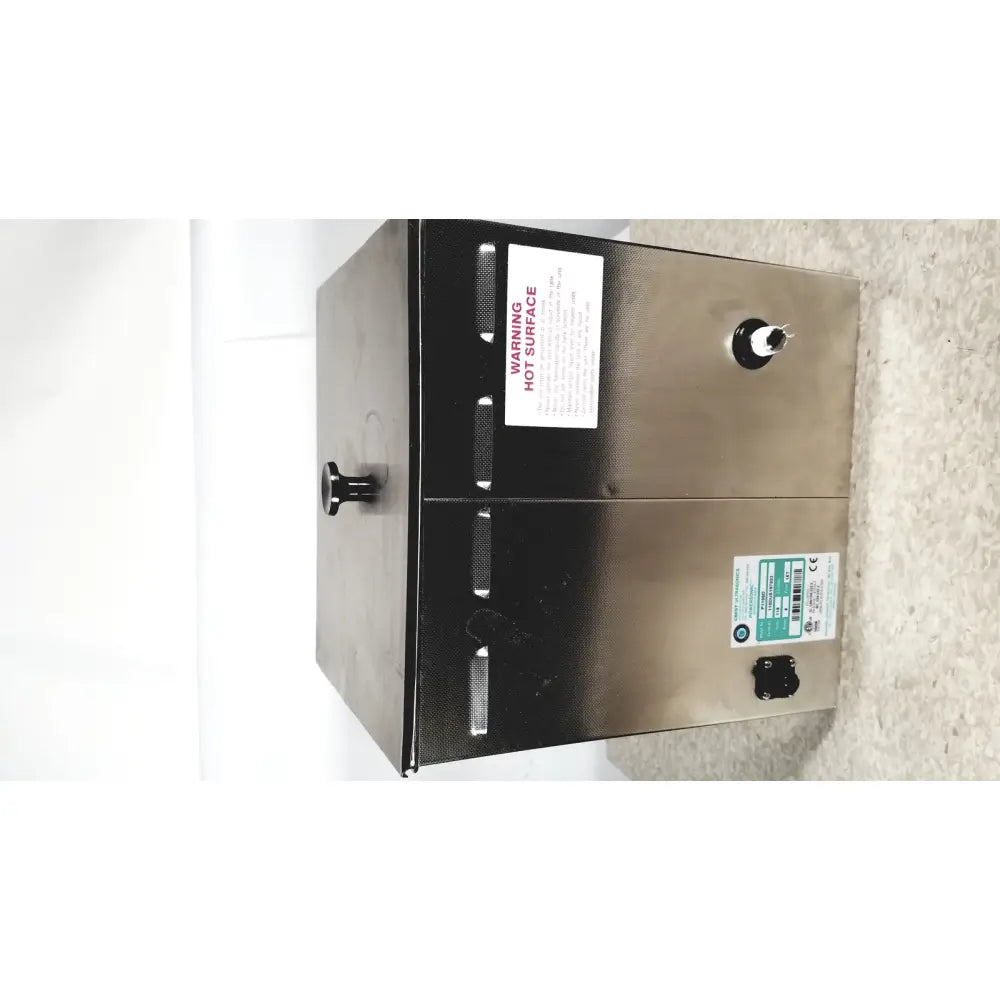 Stainless steel industrial-grade water heater with black accents and warning labels on crest ultrasonic powersonic cleaner model p1100d