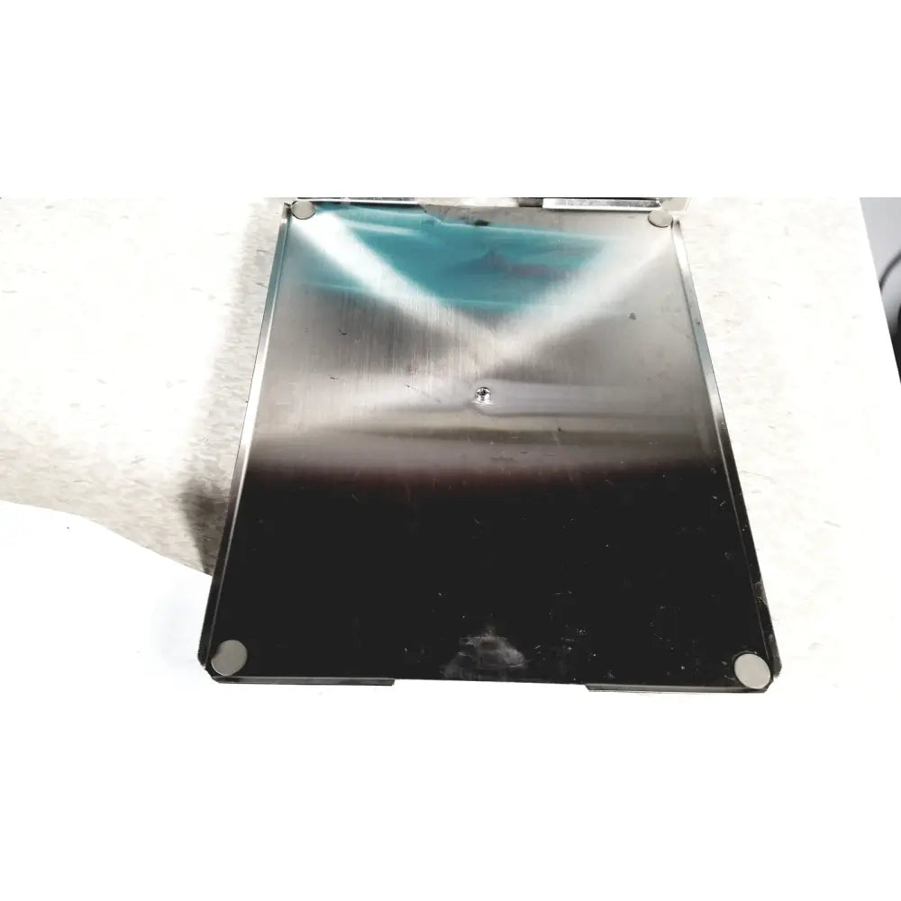 Stainless steel laptop base with black lower half and reflective upper surface of crest ultrasonic powersonic cleaner model p1100d