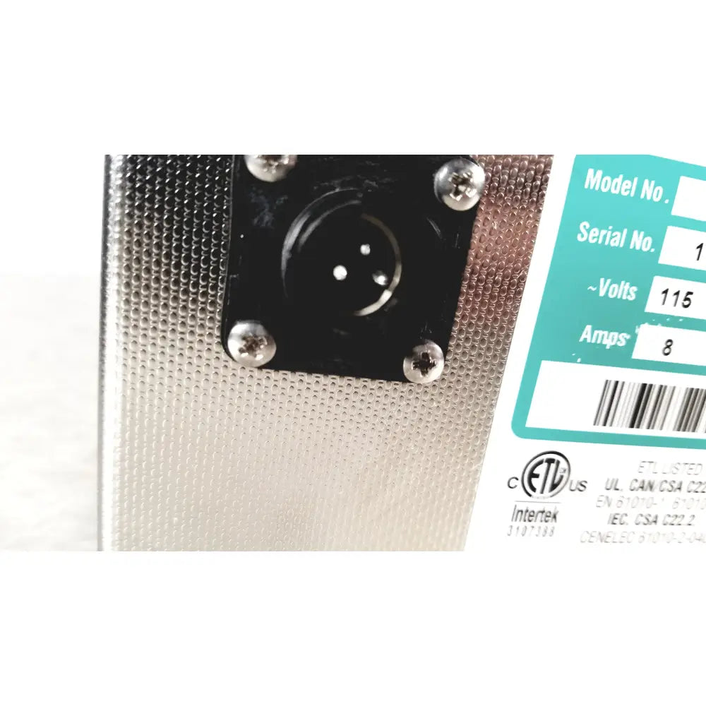 Silver perforated metal back panel of crest ultrasonic powersonic cleaner model p1100d with black xlr input jack and teal label