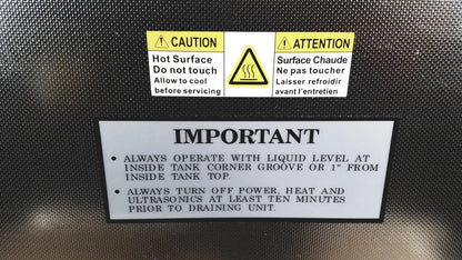 Black textured back surface of crest ultrasonic powersonic cleaner model p1100d with caution and warning labels in english and french