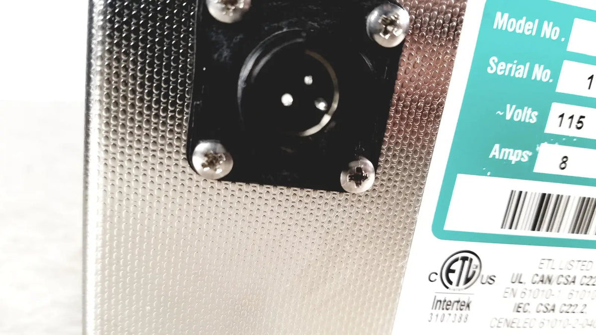 Silver perforated metal back panel of crest ultrasonic powersonic cleaner model p1100d with black xlr input jack and teal label