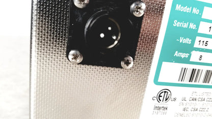 Silver perforated metal back panel of crest ultrasonic powersonic cleaner model p1100d with black xlr input jack and teal label