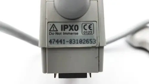 Gray plastic industrial connector with ipx0 and ce markings on the criticare 506nt3 series comfort cuff patient monitor