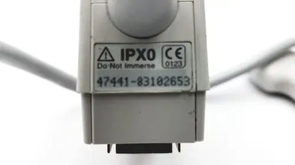 Gray plastic industrial connector with ipx0 and ce markings on the criticare 506nt3 series comfort cuff patient monitor