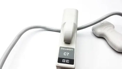 White plastic acuson c7 ultrasound machine with gray cable and transducer in criticare 506nt3 series comfort cuff patient monitor