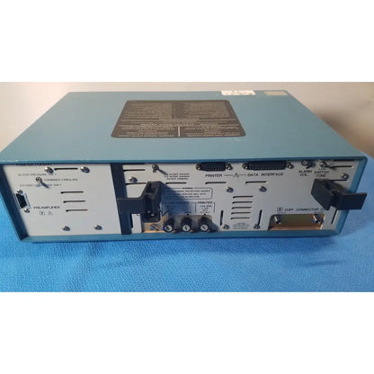 Light blue rear panel of critikon dinamap 1846 sx vital signs monitor with black labels and ports for vital signs use