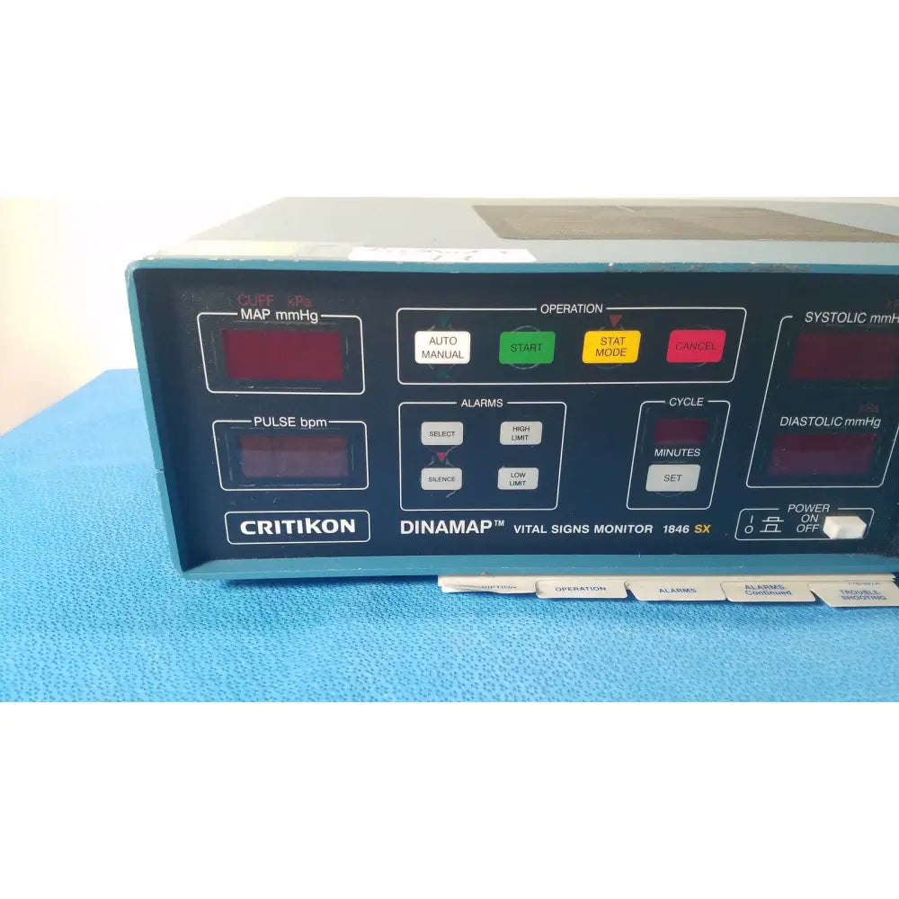 Blue plastic-faced critikon dinamap 1846 sx vital signs monitor with multicolor buttons for map pulse systolic and diastolic readings