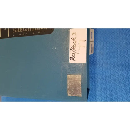 Blue industrial metal box labeled res rock 3 on back side of critikon dinamap 1846 sx vital signs monitor with oxytrak
