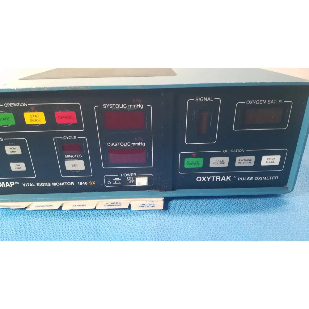 Blue and black Critikon Dinamap 1846 SX vital signs monitor with oxytrak pulse oximeter and red digital displays