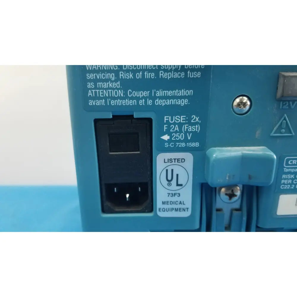 Blue plastic power supply unit with black ac input port and ul label for medical use on back of critikon dinamap plus vital signs monitor