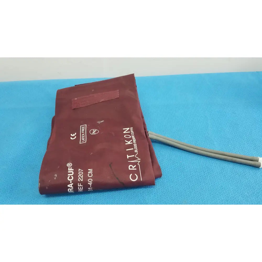 Maroon Critikon DURA-CUF large adult blood pressure cuff with gray tubing for adult blood pressure monitoring