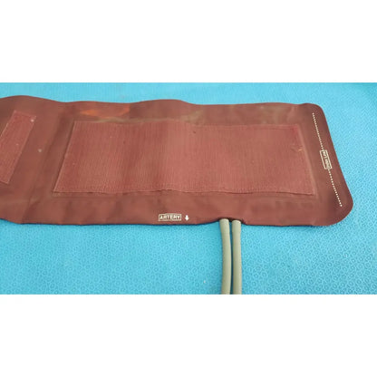 Brown textured fabric Critikon DURA-CUF large adult blood pressure cuff with printed labels for adult blood pressure use