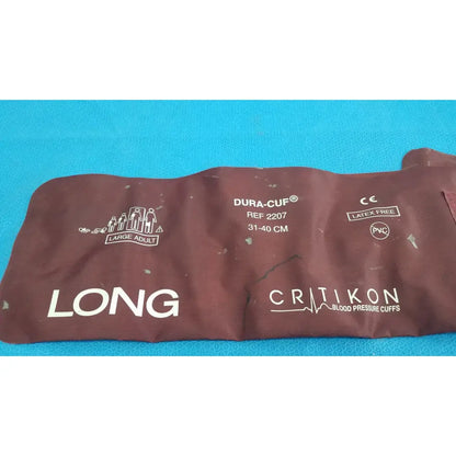 Brown pvc critikon dura-cuf large adult blood pressure cuff with white printed branding and sizing details