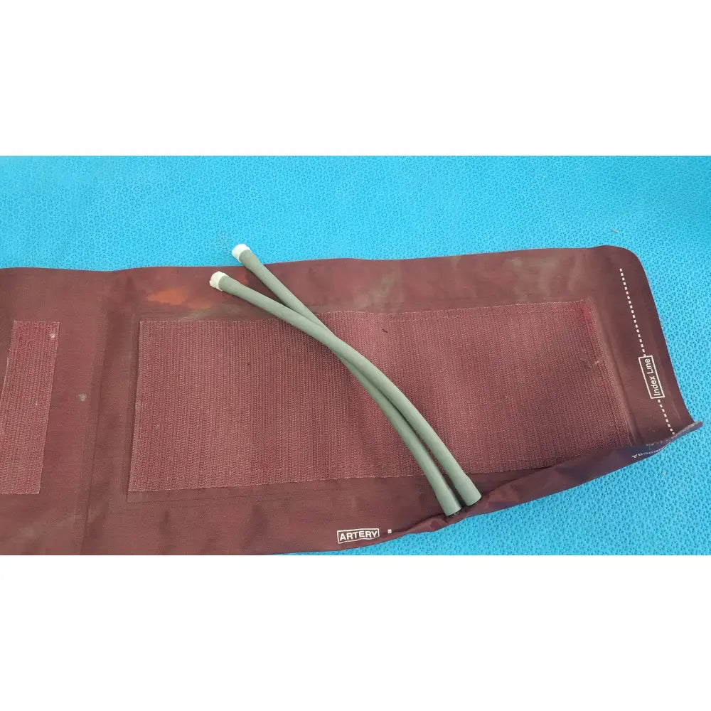 Critikon dura-cuf large adult blood pressure cuff maroon fabric with olive-green tubes branded artery for adult blood pressure monitoring