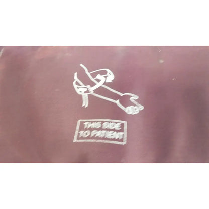 Maroon fabric pouch with white embroidered stylized figure and this side to patient text for large adult blood pressure cuff
