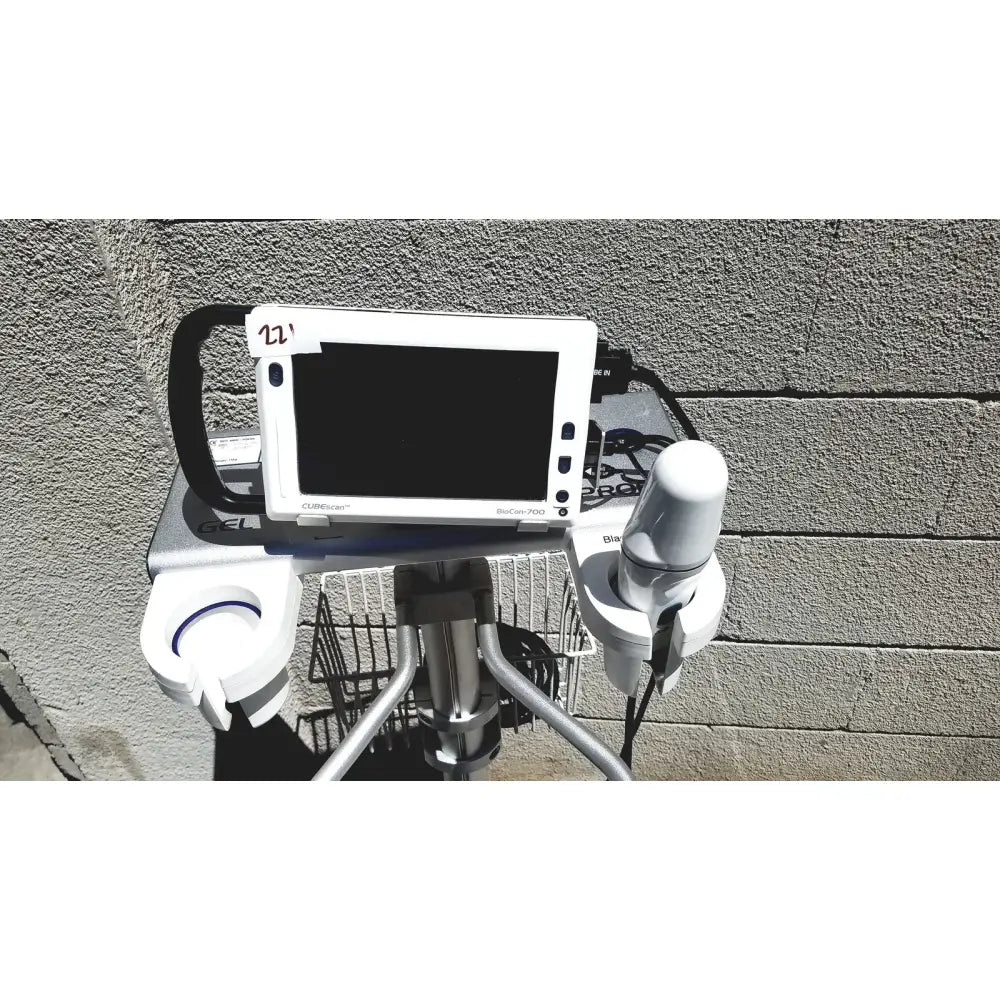 White biocare 7500 ultrasound machine with black handle and silver metallic frame for bladder volume measurement
