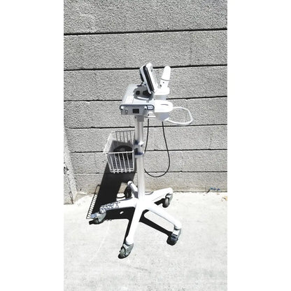 White medical cart with mounted diagnostic device and wire basket for cubescan biocon-700 bladder volume measurement system