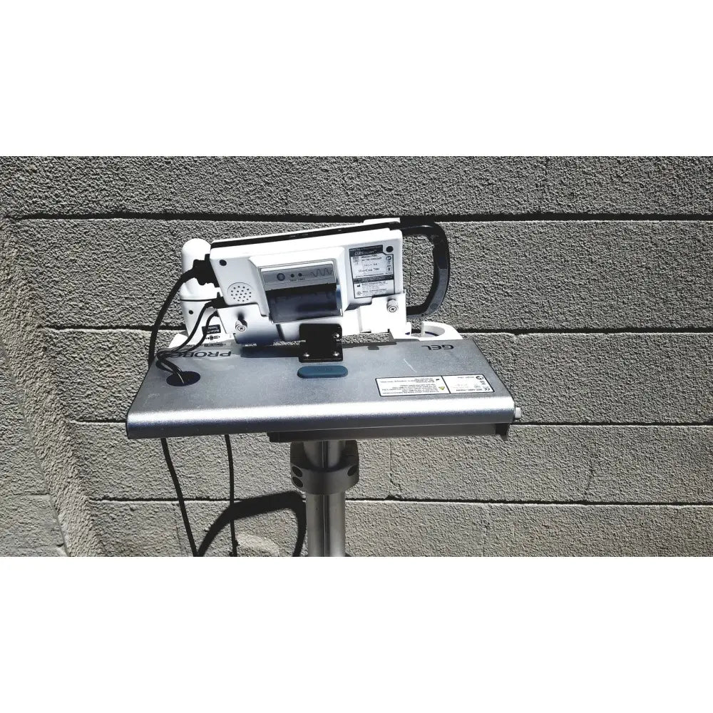 Silver metallic projector stand with white and black projector in cubescan biocon-700 bladder volume measurement system