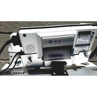 White plastic bio-coin 700 coin validator with black cable and model label for bladder volume measurement system