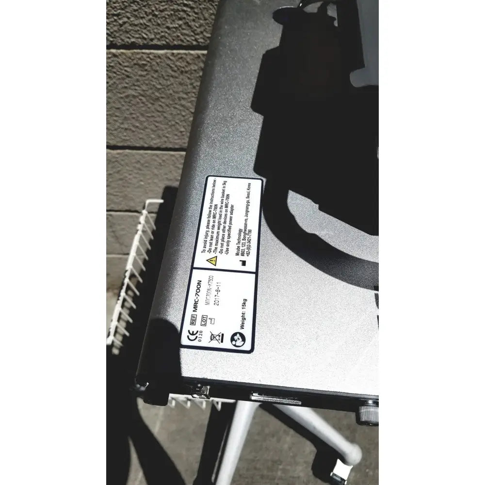 Silver and black mrc-70dn industrial laser cutter with matte finish casing for cubescan biocon-700 bladder volume measurement system