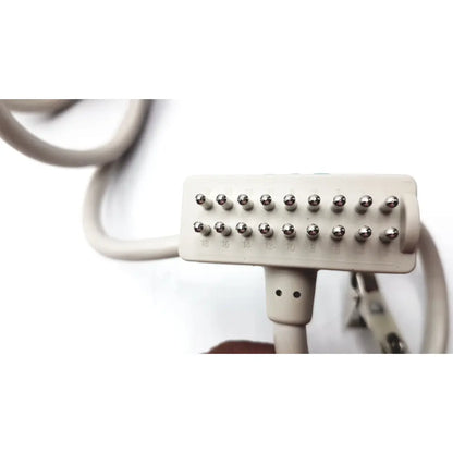 Beige plastic hair straightener with metallic heating pins and numbered settings for curbell getwell network nurse call remote