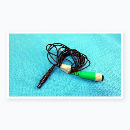 Green and gray medical catheter connector cable with black coiled wire for reuse medical equipment in EnSite X system
