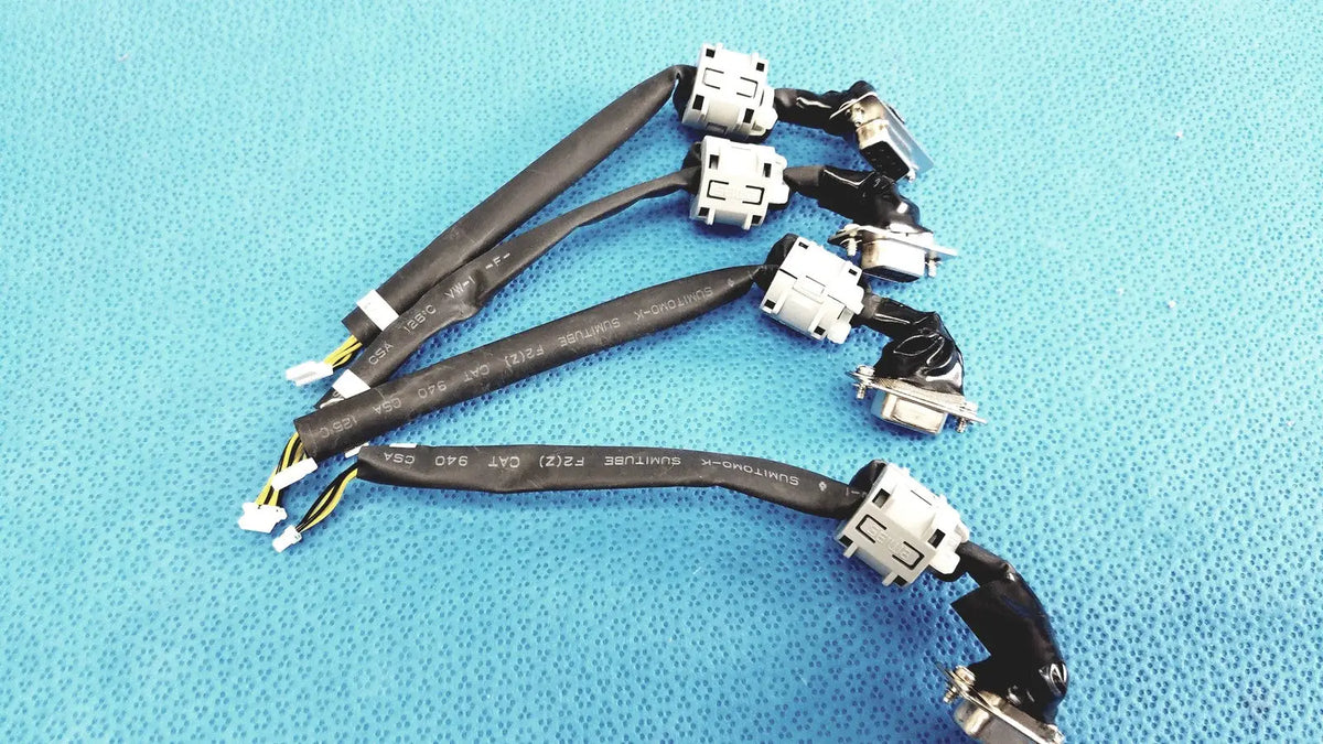 Black insulated d-sub 9-pin serial to 4-pin wire harness cable with white connectors and printed specifications for industrial use