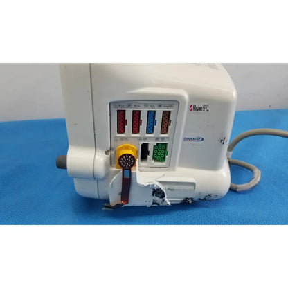 White plastic medical ventilator with colored ports and yellow control knob for dash 3000 masimo set ref patient monitor