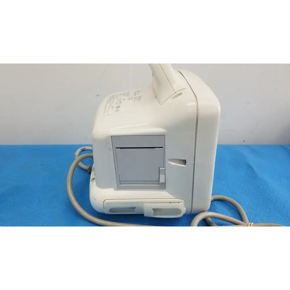 White plastic dash 3000 masimo set ref patient monitor with gray panel and attached cables for medical use