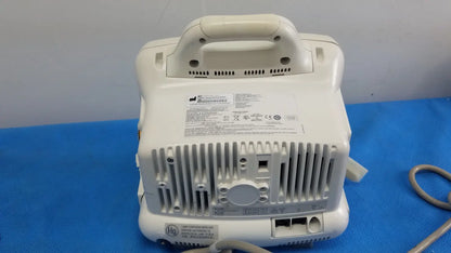 White plastic portable medical device with handle and ventilation slats in masimo set ref patient monitor dash 3000