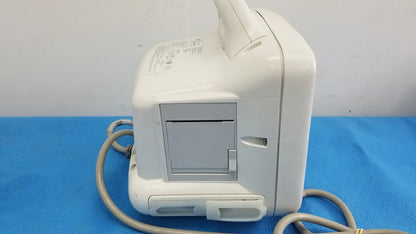 White plastic dash 3000 masimo set ref patient monitor with gray panel and attached cables for medical use