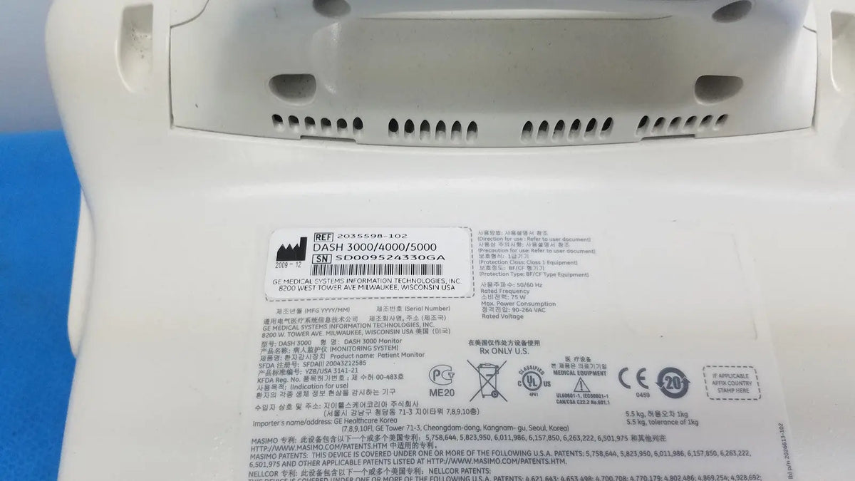 White plastic medical device label with black text barcode showing model numbers dash 3000 4600 5000 masimo set ref