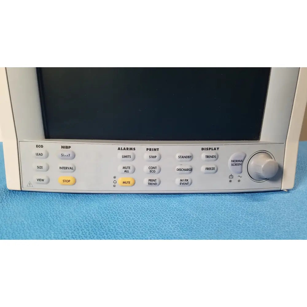 White datascope passport 2 ecg nibp ekg patient monitor with black screen and gray control panel featuring labeled buttons