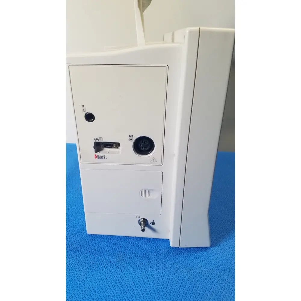 White plastic datascope passport 2 ecg nibp ekg patient monitor with labeled ports and keyhole on the back side