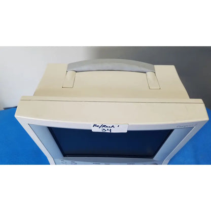 Beige plastic datascope passport 2 ecg nibp ekg patient monitor with gray handle and pansophic branding