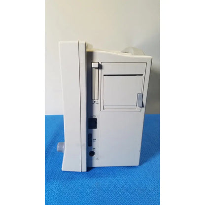 White plastic Datascope Passport 2 ecg nibp ekg patient monitor with vertical paper slot and multiple side ports